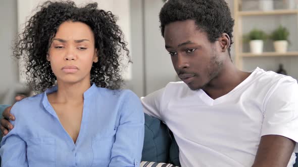African Man Talking with Sad Girlfriend