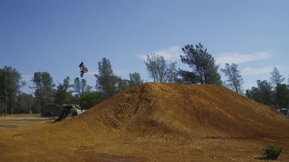 Motocross rider going off big jump, slow motion, 4K shot on RED Epic