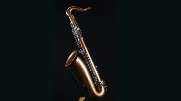 Rotating Saxophone On A Black Background.