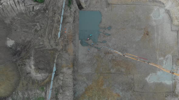 A pump pouring concrete at the construction site