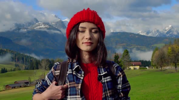 Portrait Free Happy Young Hiker in Red Hat Woman Looking at Camera Enjoying Calm Alps Day in Nature