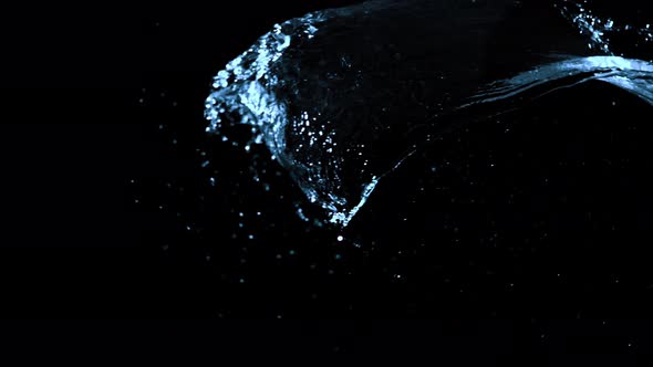 Super Slow Motion Shot of Water Splash Against Black at 1000Fps alt