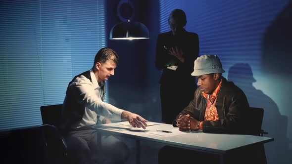 Suspected Mixed-race Man Signing a Document of Accusation