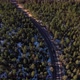Snow Capped Mountains Forest Highway Road Car Aerial Pan Up Shot 4K - VideoHive Item for Sale