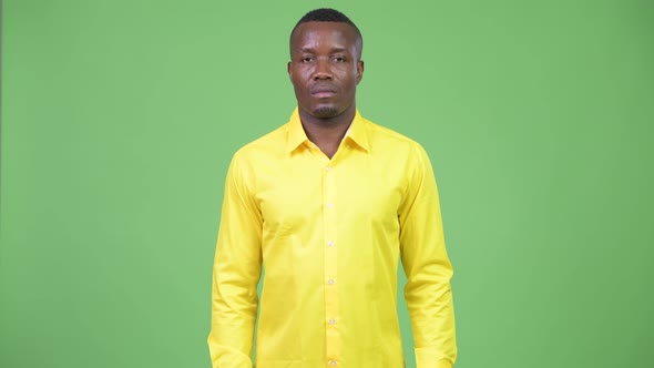 Young African Businessman Wearing Yellow Shirt