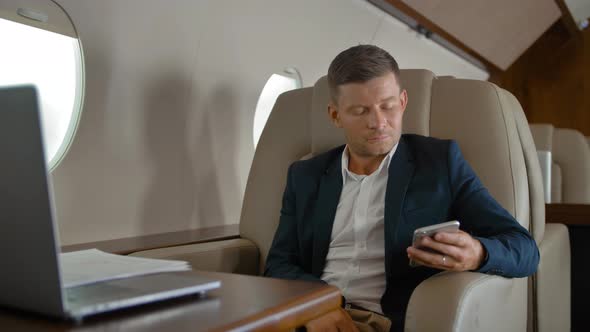 Business Man Chat in Private Jet Cabin