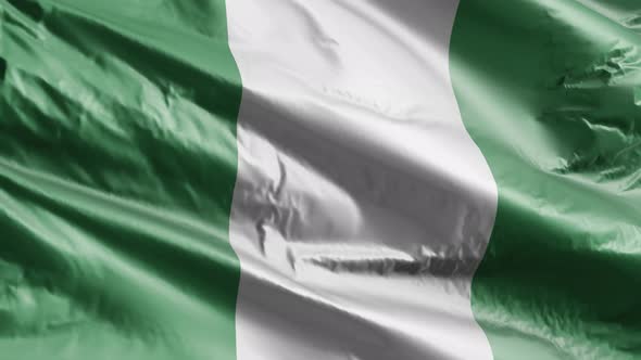 Nigeria textile flag waving on the wind. Slow motion. 20 seconds loop.