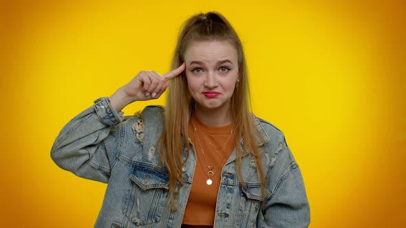 Teen Girl in Jacket Pointing at Camera and Showing Stupid Gesture Blaming Some Idiot for Insane Plan