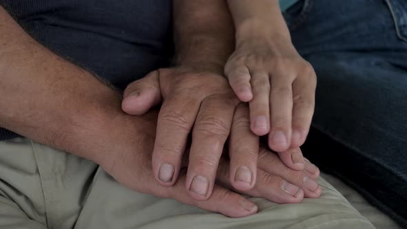 Closeup Caring Woman Holds Strokes Hands Of An Old Man Supporting And Calming