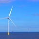 Windmills generating green energy at the sea in 4K - VideoHive Item for Sale