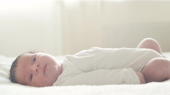 Close-up portrait of a young baby who has recently been born.