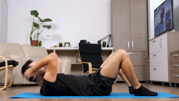 Young Fit Man Doing Ab Exercises