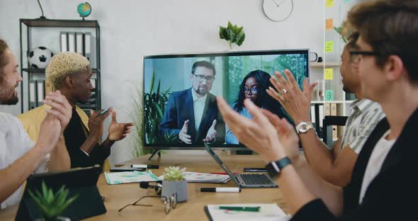 Colleagues Clapping Hands After Successful Ending Video Conference with International Partners