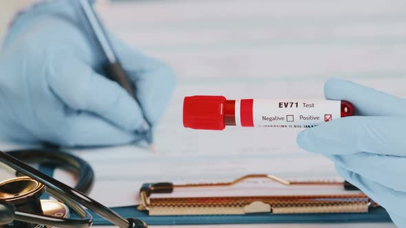 Doctor Holds in Hand Laboratory Positive Blood Test Tube with Enterovirus