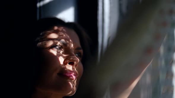 Closeup Portrait of Beautiful Joyful Woman Near Window in Sunny Early Morning Shadow By Tulle