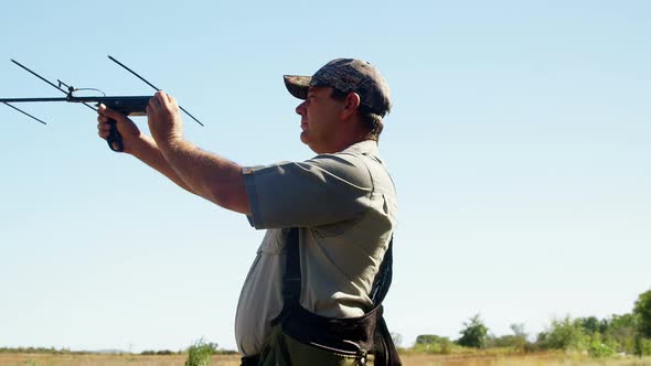 Man aiming with crossbow