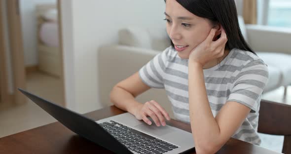 Woman watch on computer at home