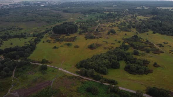Birds eye view aerial shot flying over a beautiful nature reserve in Britain