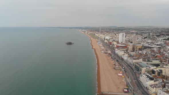 Aerial footage of the Brighton and Hove town centre showing hotels, guest houses and British beach