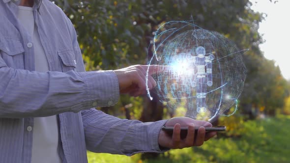 Man Shows Hologram with Simple Cyborg