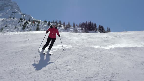 Skier Fast Slides Down Slalom On Snowy Slope In Mountains In Winter On Ski