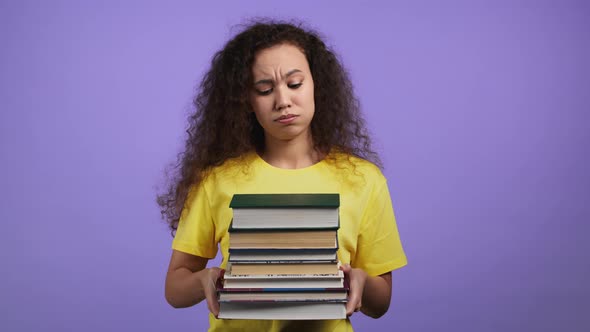 European Student is Dissatisfied with Amount of Homework and Books on Violet Background