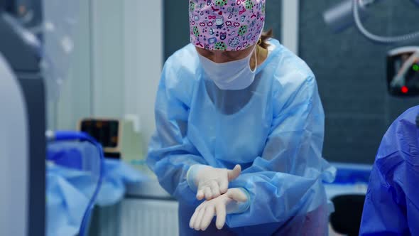 Operation on eye in modern surgery. Surgeon prepares tampons.