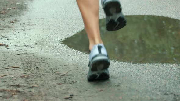 Triathlete Running, Sprinting And Endurance Marathon Workout. Running Man On Puddle. Runner Jog.