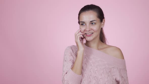 Positive Caucasian Young Woman Talking on the Phone