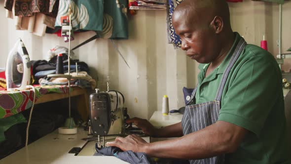 African man sewing tissue