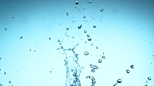 Super Slow Motion Shot of Water Splash at 1000Fps on Blue Gradient Background