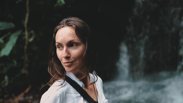 Girl Tourist at Tropical Forest Waterfall Close Up