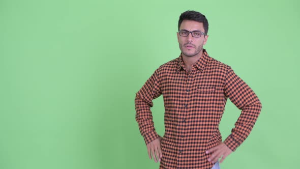 Stressed Young Hispanic Hipster Man Touching Something and Giving Thumbs Down