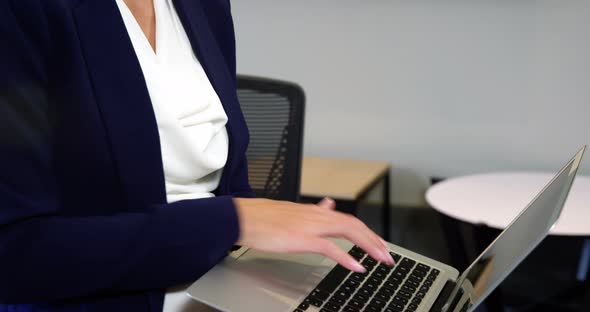 Businesswoman using laptop