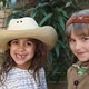 Two girls dressed as cowgirl and Native American - VideoHive Item for Sale