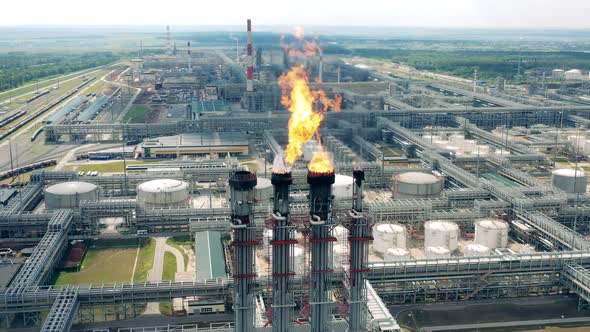 Pipes of the Oil Refinery are Flaring Gas