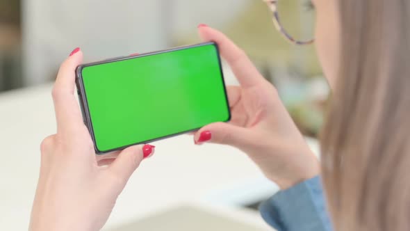 Woman Holding Smartphone with Green Screen