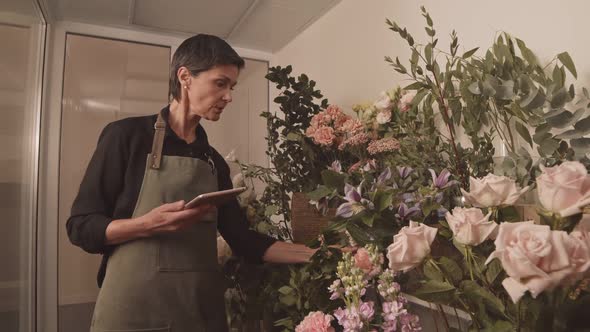 Female Florist Doing Inventory Check