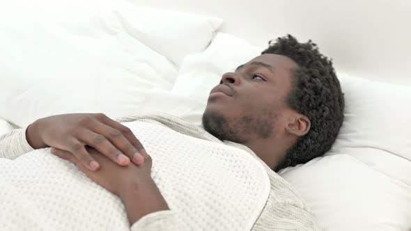 Screaming African Man in Bed