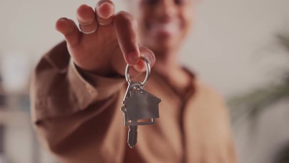 Happy African American Woman Holding Keys Close Up Focus on Hand