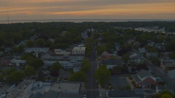 Lowering Aerial View of Suburban Houses in Greenport Long Island at Sunset