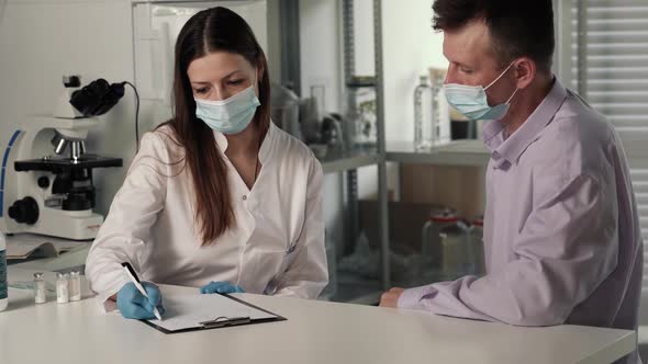 Female Hands Doctor Nurse in Latex Gloves Hold Syringe with Medicine Vaccine