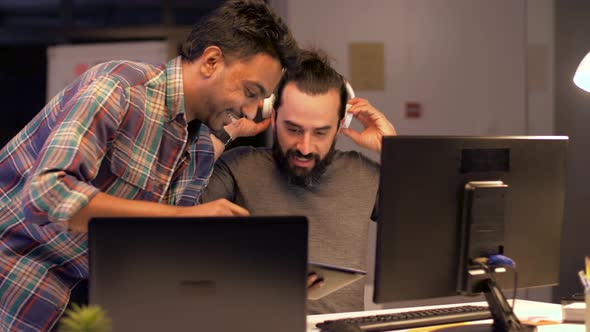 Men with Tablet Computer Talking at Night Office 33