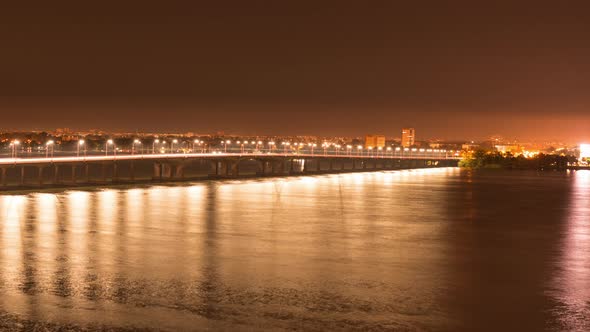 The Long Bridge is Bathed in Cold Bright Light