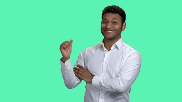 Young Indian Businessman Pointing at Copy Space