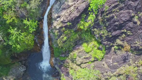 Camera Moves From Lake Along High Waterfall TaGu in Jungle