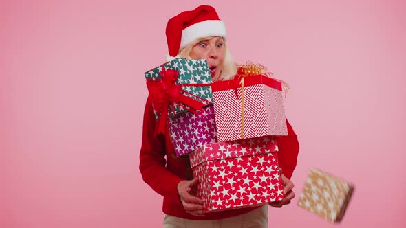 Senior Grandmother Woman in Christmas Sweater Holding Many Gift Boxes New Year Present Shopping Sale