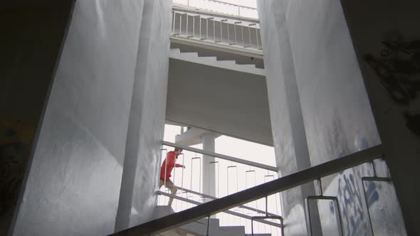 Athlete Running Down Urban Stairs