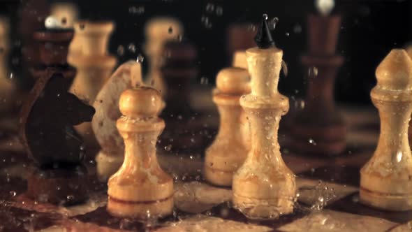 Super Slow Motion on the Chessboard with the Pieces Falling Drops of Water