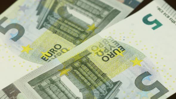 close-up of 5 euro bills rotate. European currency paper money. 5 euro banknote